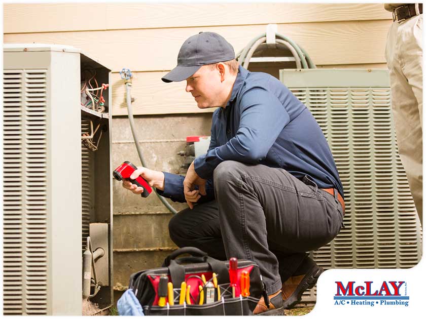 HVAC installer performing maintenance